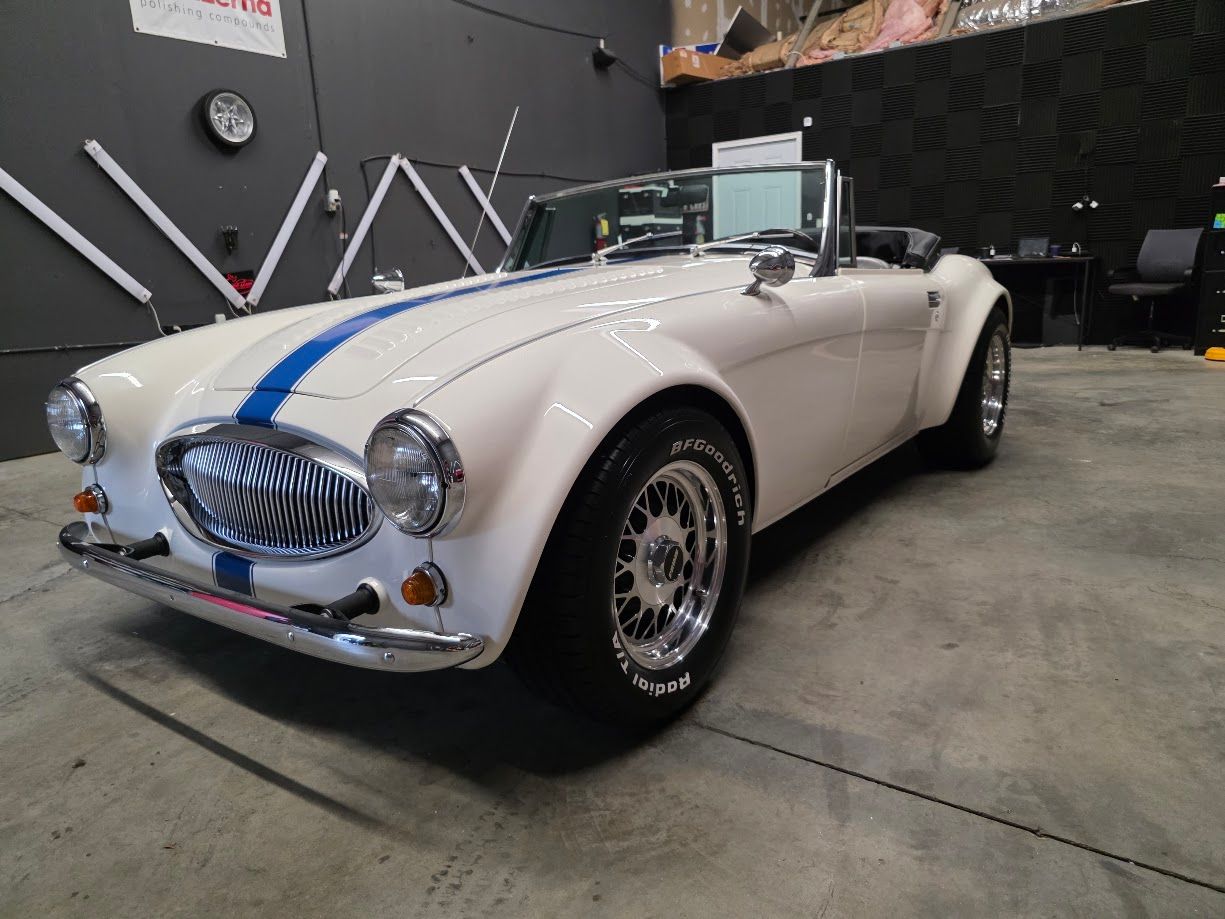 Bespoke ceramic coating on a vintage white convertible for a high-gloss, showroom finish in Newnan, GA.