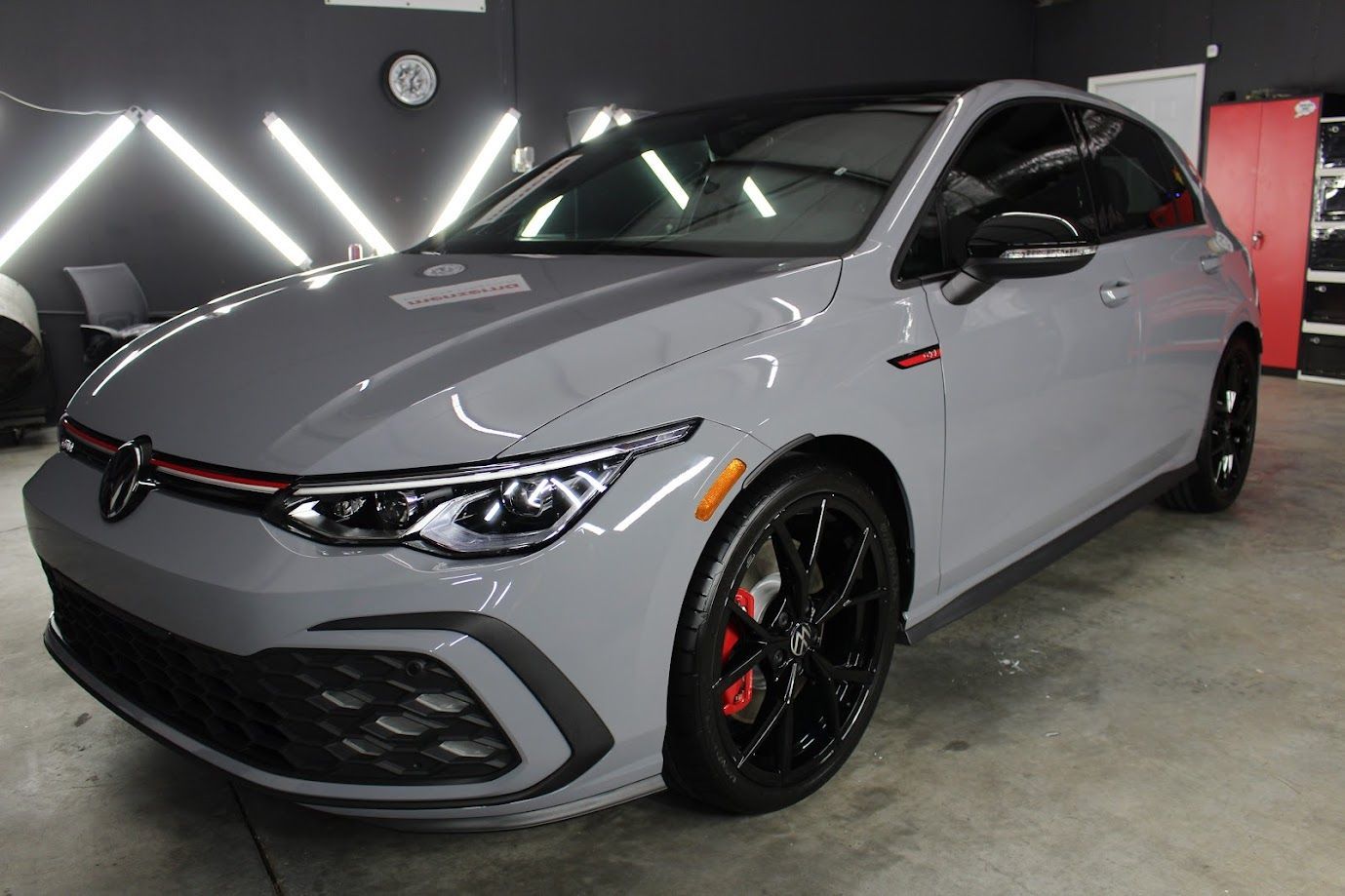 5-year ceramic coating application on a modern grey hatchback, providing long-term UV protection and a slick, gloss finish.