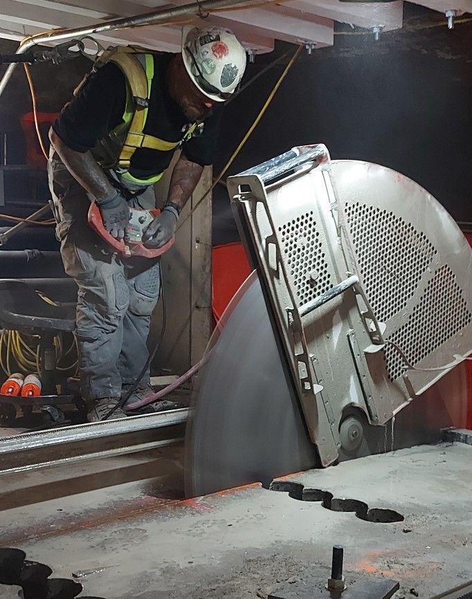 Gray cracked concrete wall.