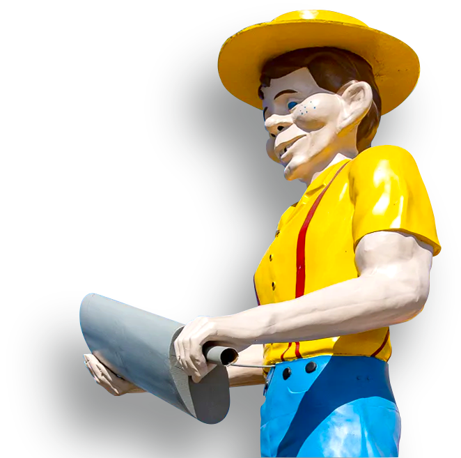 A woman with red hair and green glasses is pointing up.