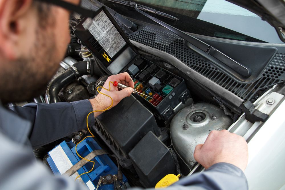A Mechanic Uses a Circuit Tester to Check the Fuses — Roberts Automotive & Industrial in Brighton, TAS