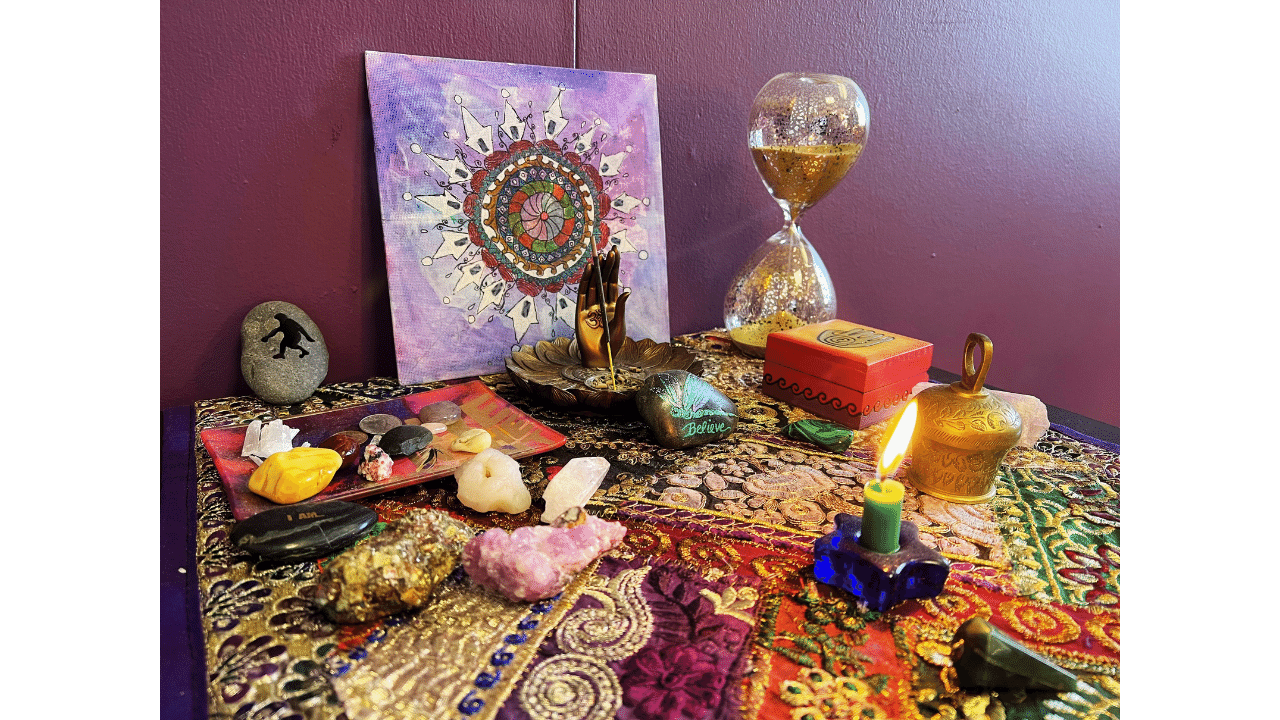 sacred space in light of mine's energy healing office denver with candles, mandala and ritual items