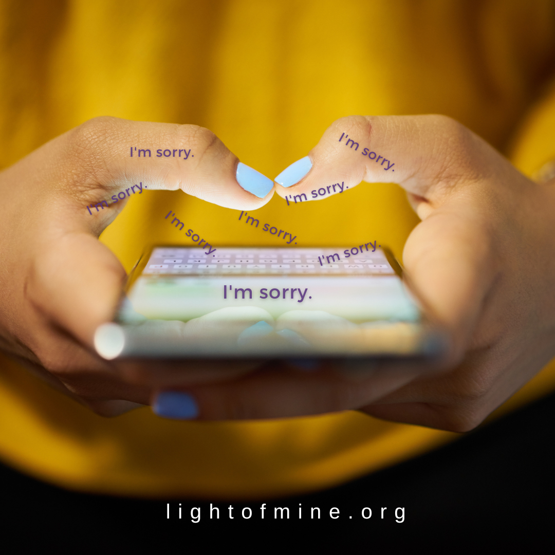 a woman holds a phone with the text 