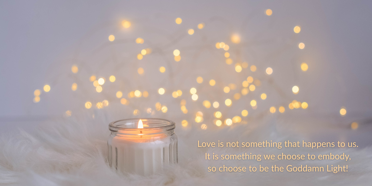 a candle and soft gold lights with quote