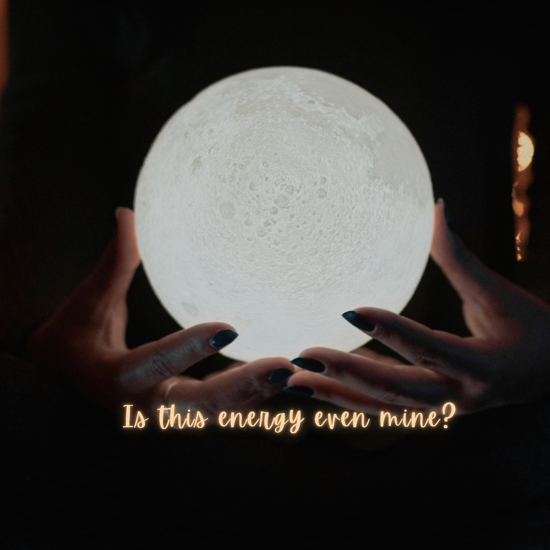 a woman holds the glowing moon 