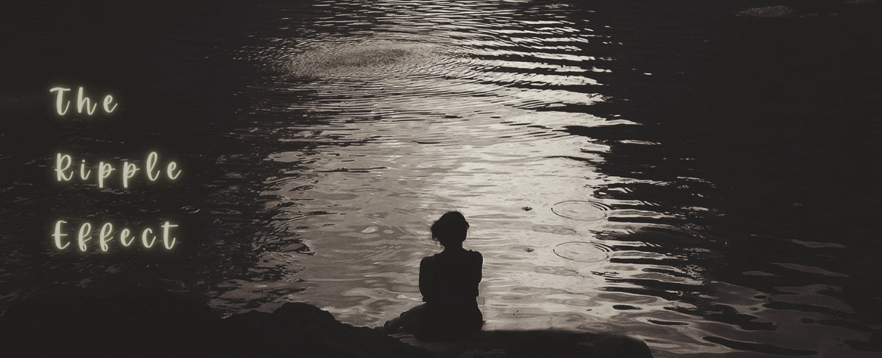 a silhouette of a woman by water making ripples