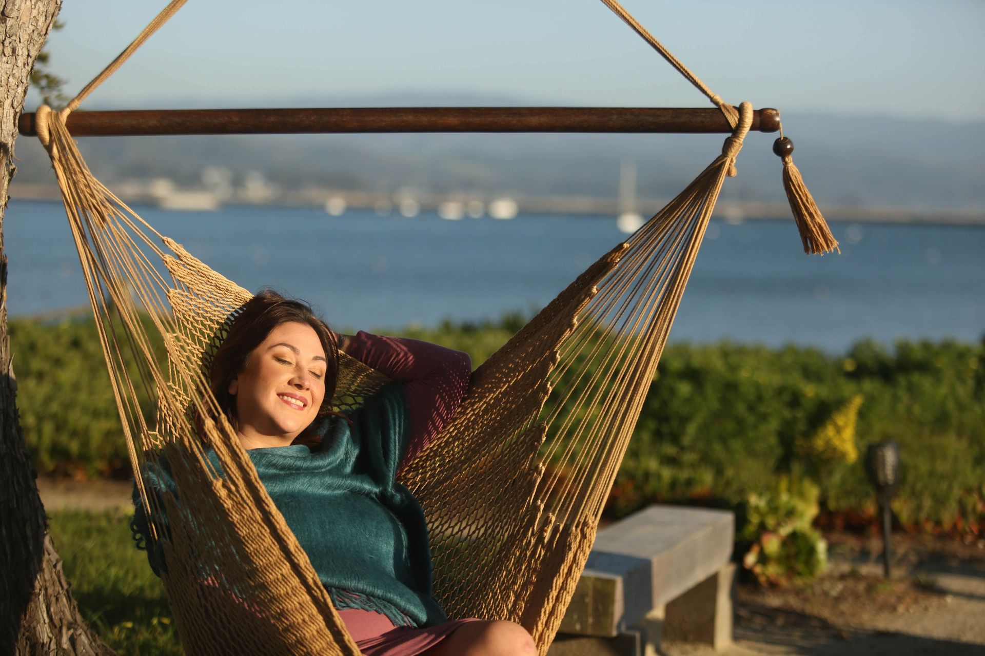 A group of five people sitting in a circle in a bright office, engaged in a discussion.