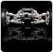 Silver sports car with wheels reflected on a dark surface. | Quality Car & Truck Repair Inc