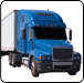 Blue semi-truck with white trailer, angled left, on road.  |  Quality Car & Truck Repair Inc