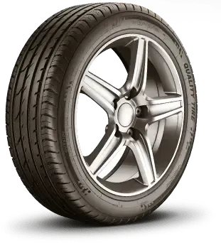 Car tire on a silver alloy wheel, with tread pattern visible. 