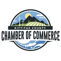 Kittitas County Chamber of Commerce logo with mountains, wind turbines, and fish in a circle.