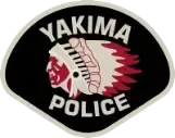 Yakima Police badge with a Native American profile, black background, and white text.