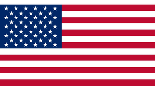 The american flag is red , white and blue with stars on it.