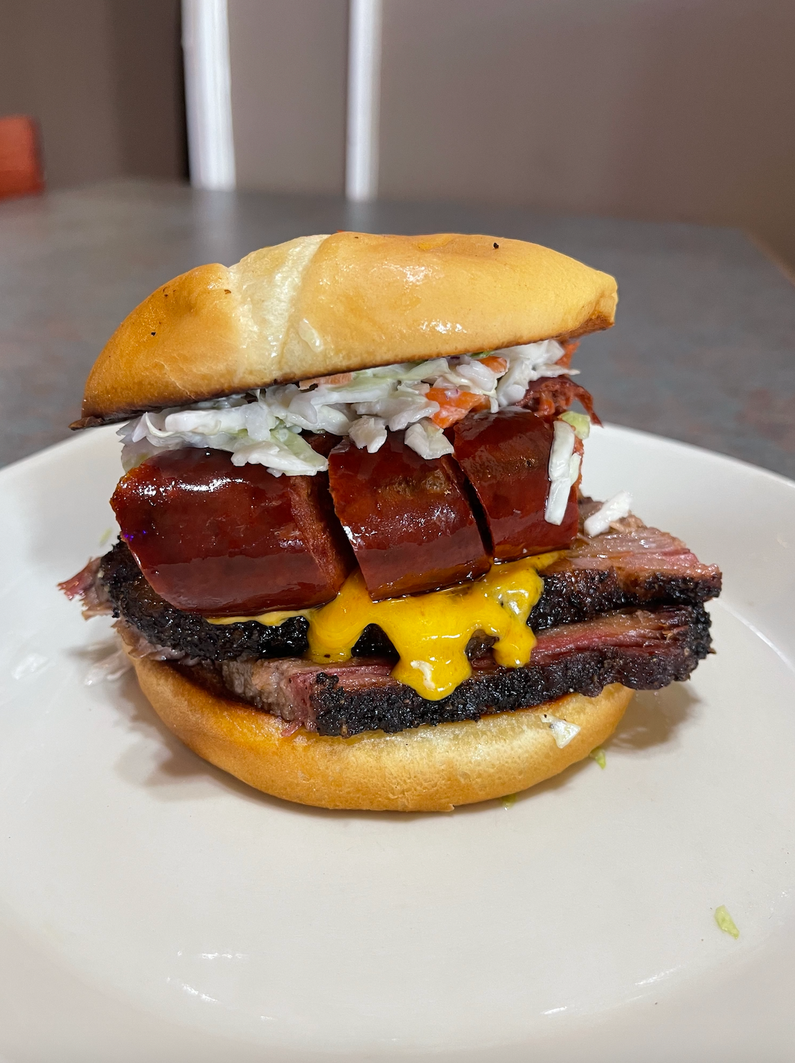 A close up of a sandwich on a plate on a table.
