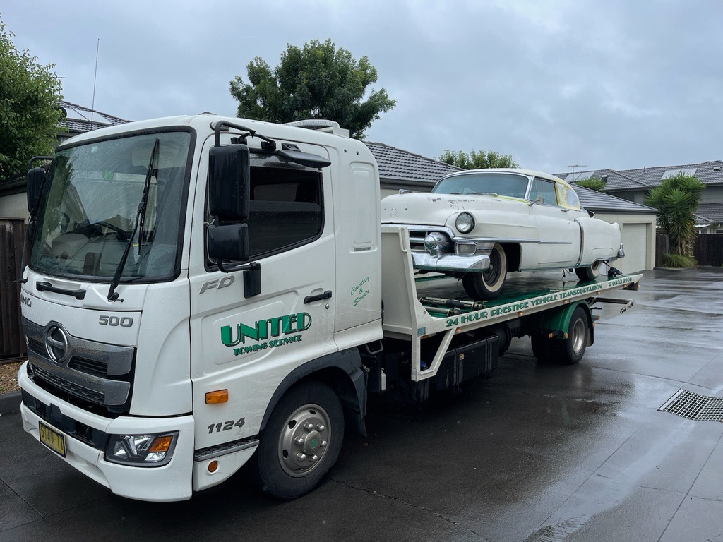 Tow Truck Driver Preparing a Broken Down RV — Sydney, NSW — United Towing Services Pty Ltd