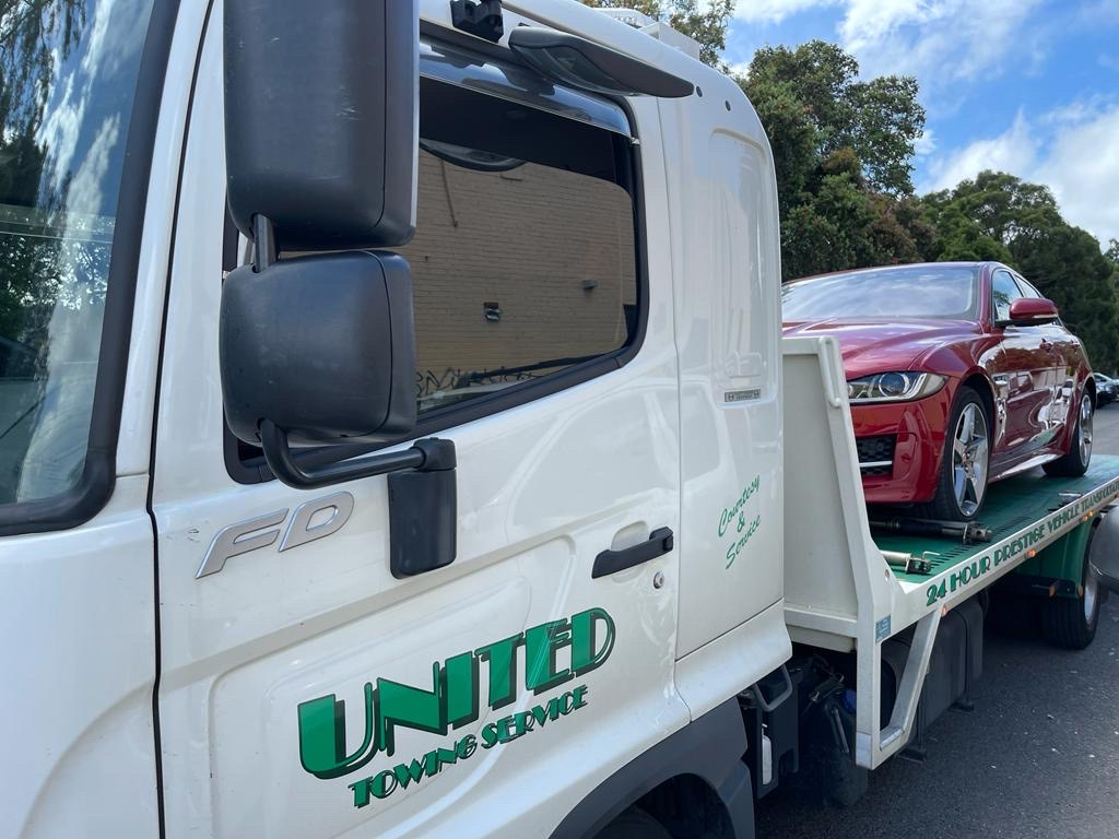 Tow Truck Towing a Broken Down Car — Sydney, NSW — United Towing Services Pty Ltd