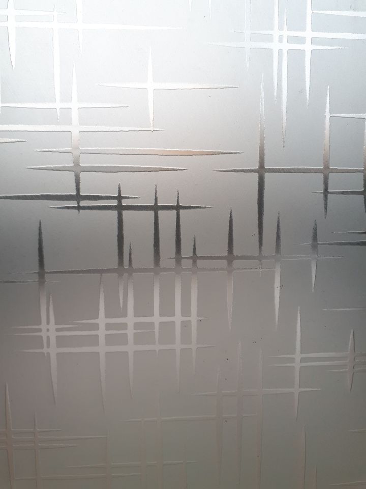 Abstract gray-and-white frosted glass with intersecting horizontal and vertical lines
