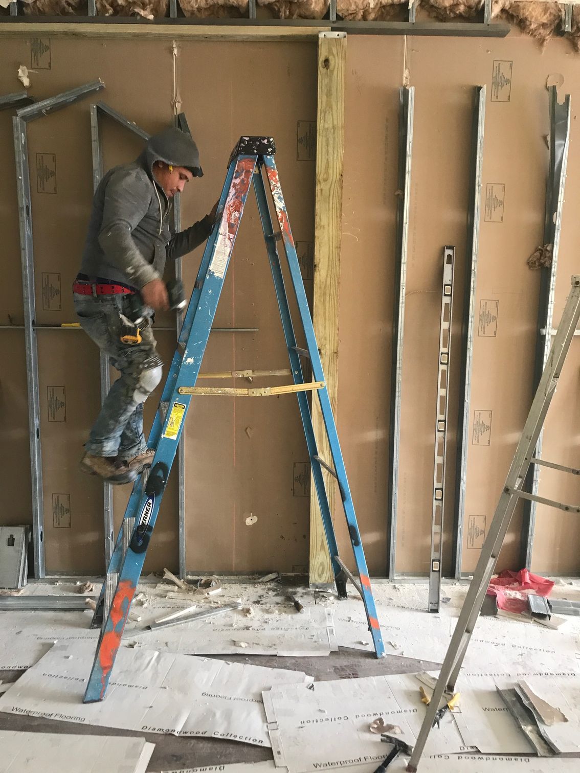 A Man Standing On A Ladder - Mount Vernon, NY - Gordon & Gordon’s Group Inc.