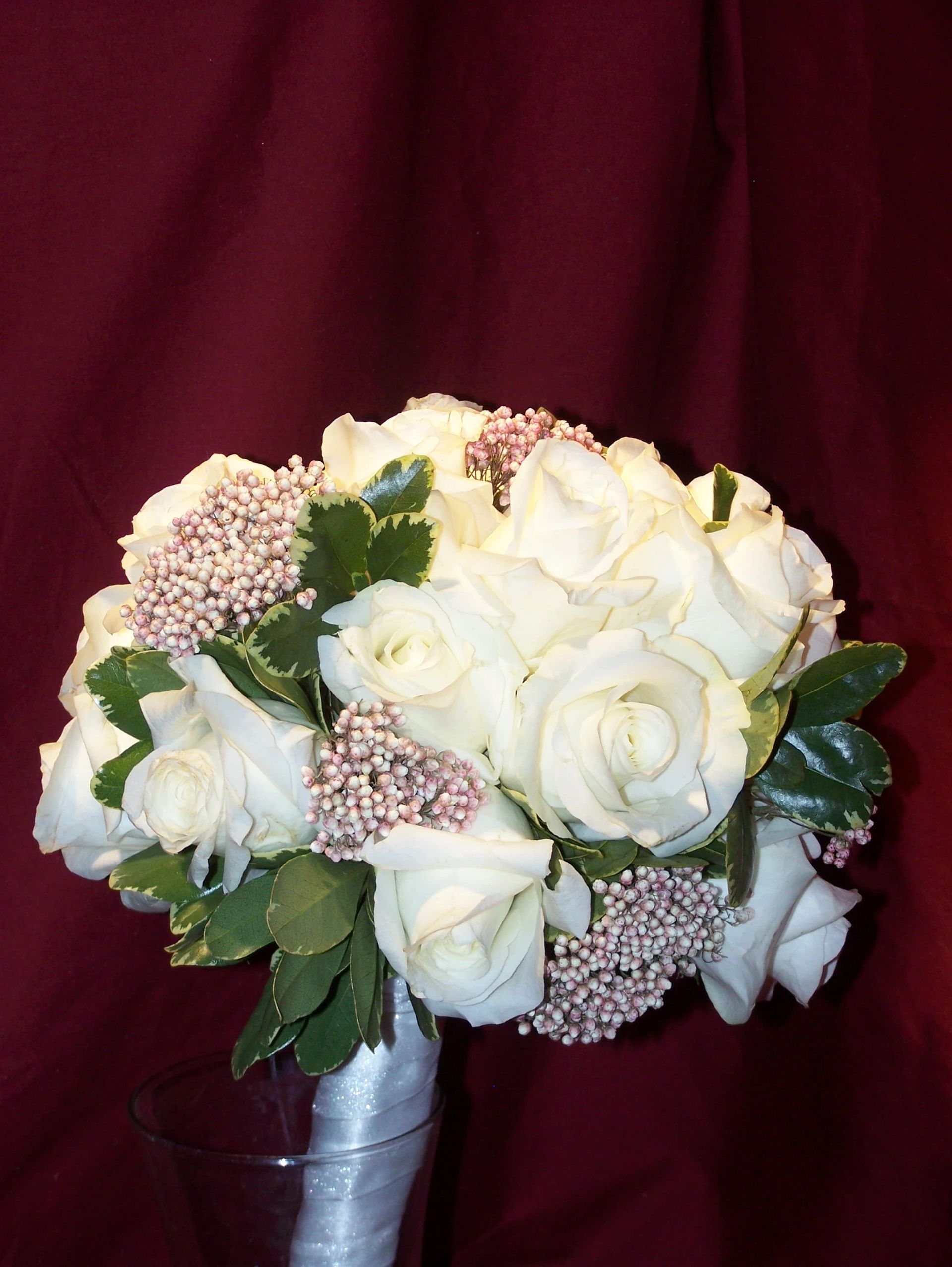 A bouquet of white roses and pink flowers
