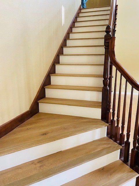Hardwood flooring stairs with white risers