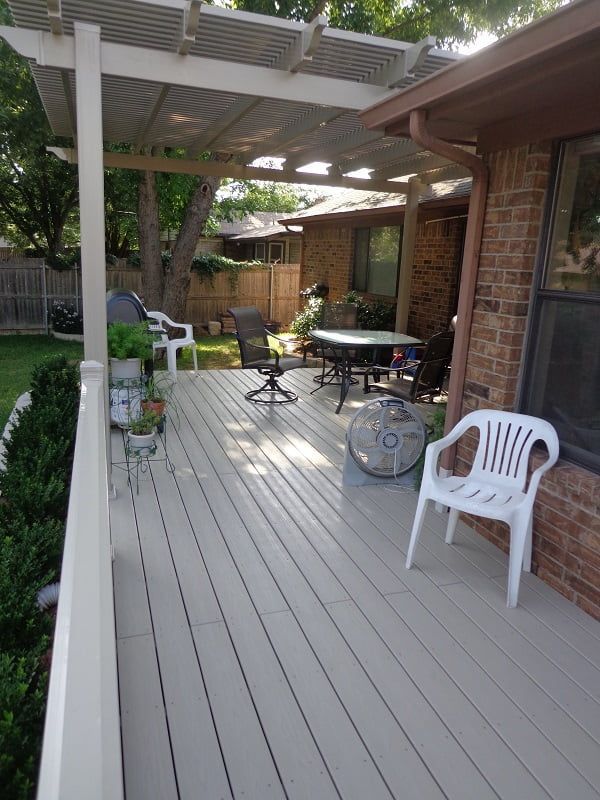 A deck with a table and chairs on it
