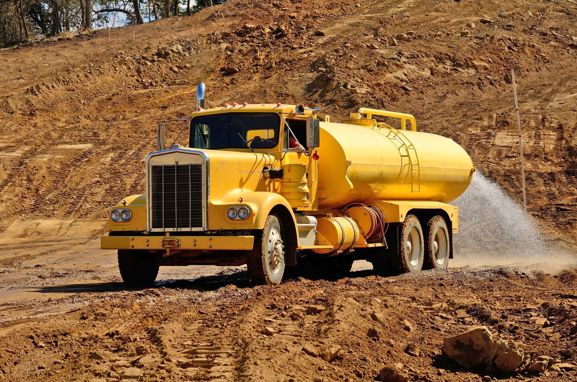 DGBalance is a dust control and stabilization product used at construction sites, applied by truck spraying for dust suppression.
