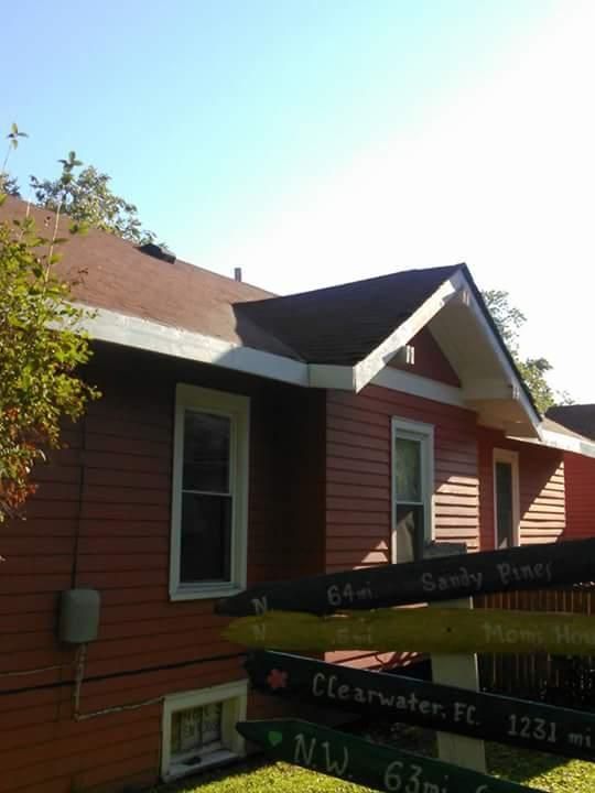 A red house with a sign that says clearwater ft