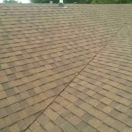 A close up of a roof with shingles on it.