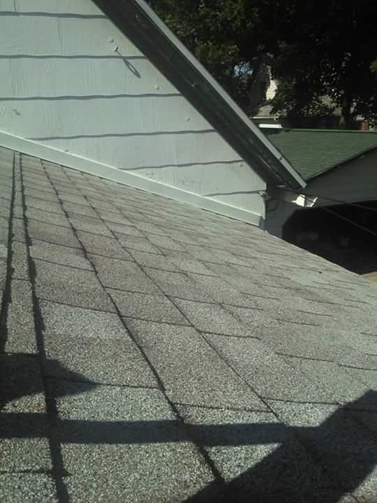 A close up of a roof with a shadow on it