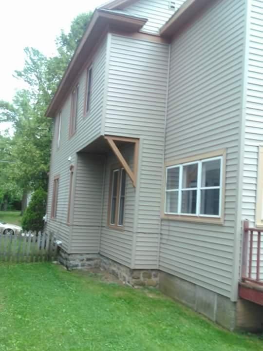 A house with a lot of windows and a balcony