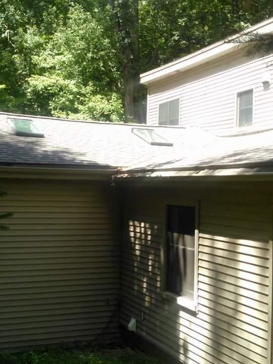 A house with a roof that has a skylight on it.