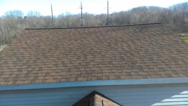 A roof of a house with a lot of shingles on it.