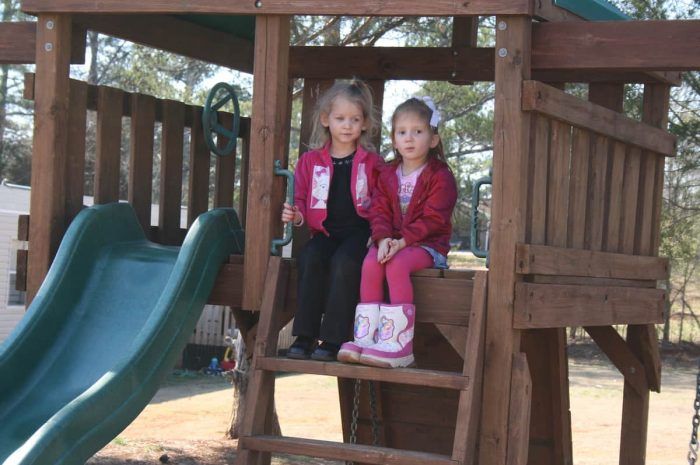 Garden Springs Homes - Playground with two girls sitting on stairs