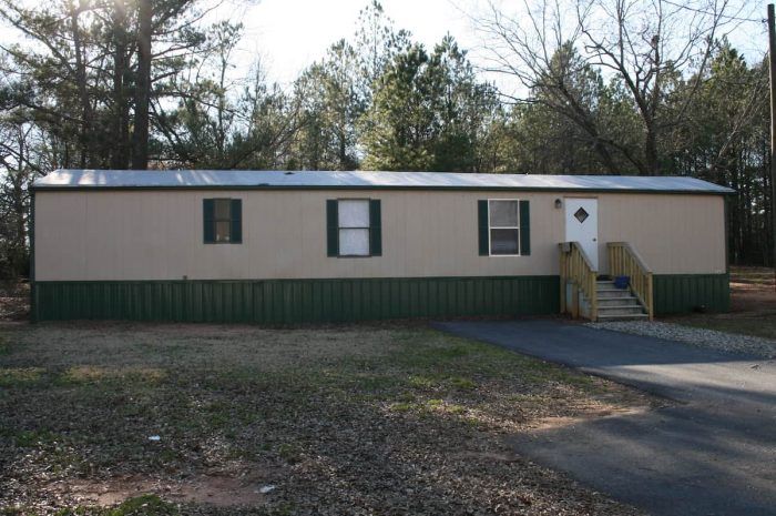 Magnolia Ridge - Mobile home with dark green trim