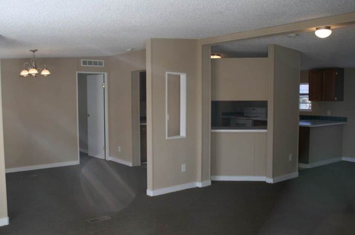 Oak Grove - Living room with view of kitchen through cut out in wall