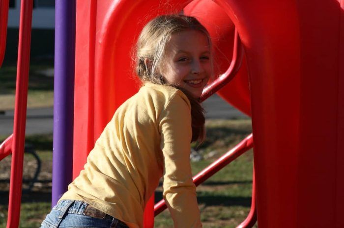 Oak Grove - close-up of girl on playground