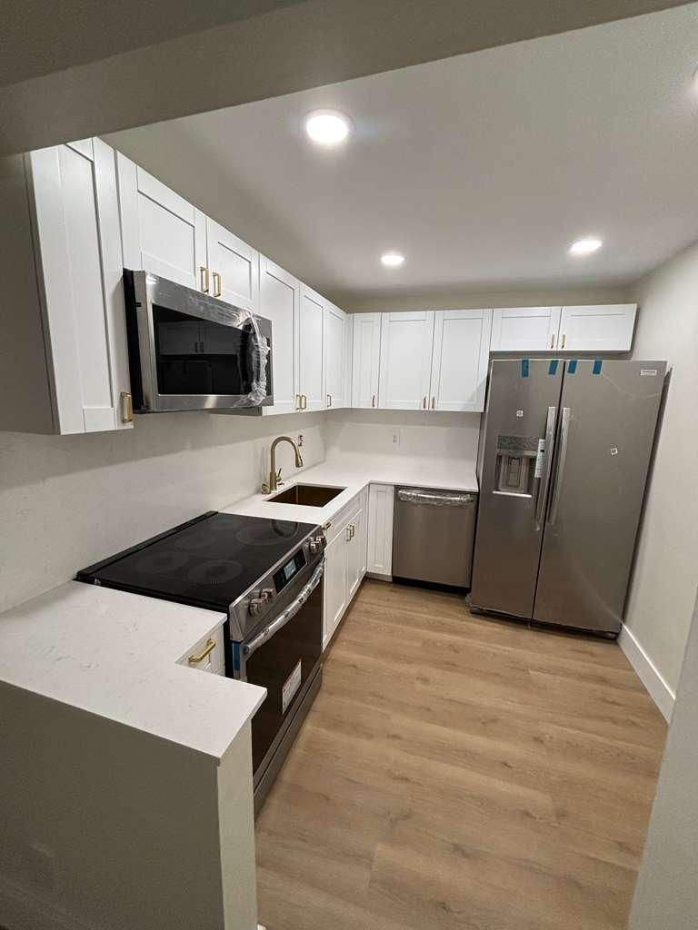 A renovated kitchen with new appliances
