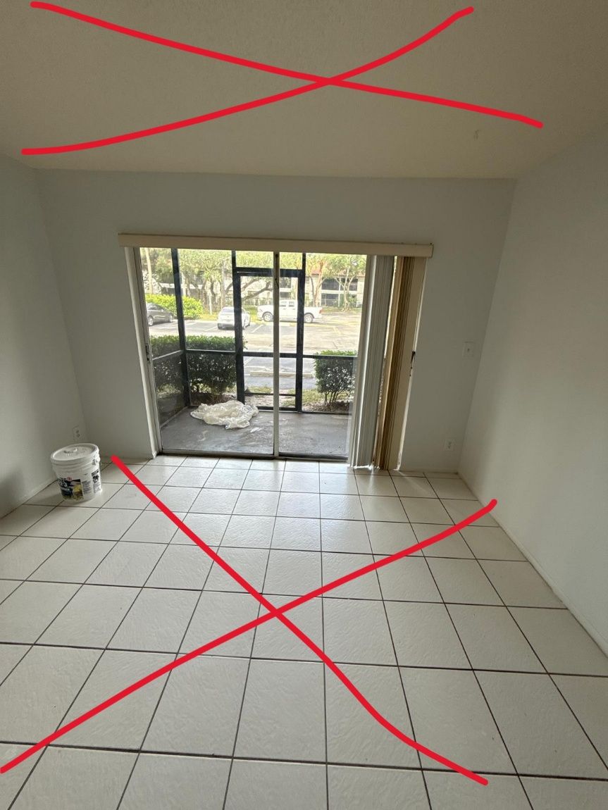 A tiled living room with a red