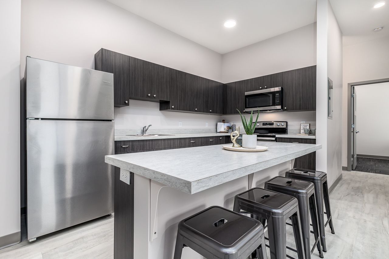 View of the kitchen in a 4 bedroom apartment at College Suites in Peosta, Iowa close to NICC's college campus