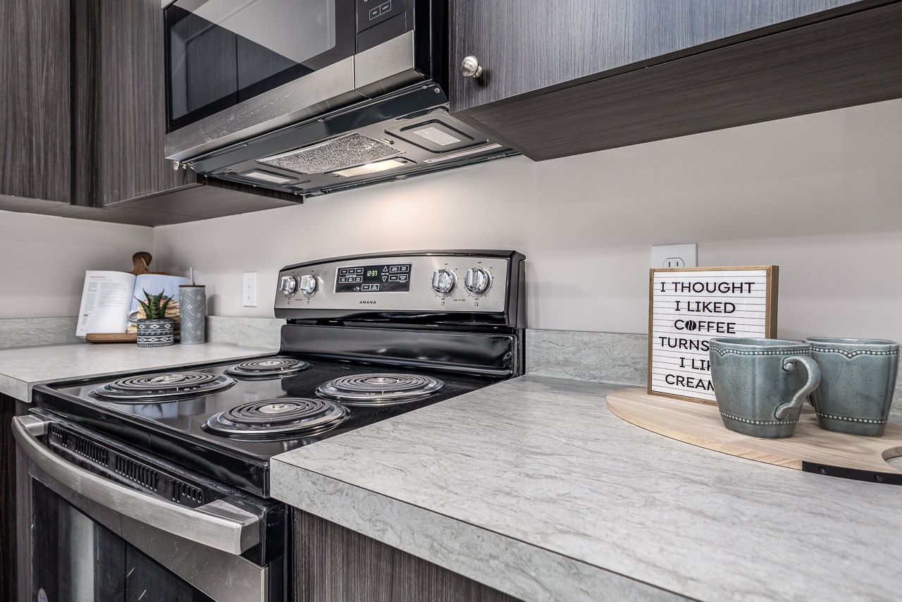 View of the kitchen in a 4 bedroom apartment at College Suites in Peosta, Iowa close to NICC's college campus