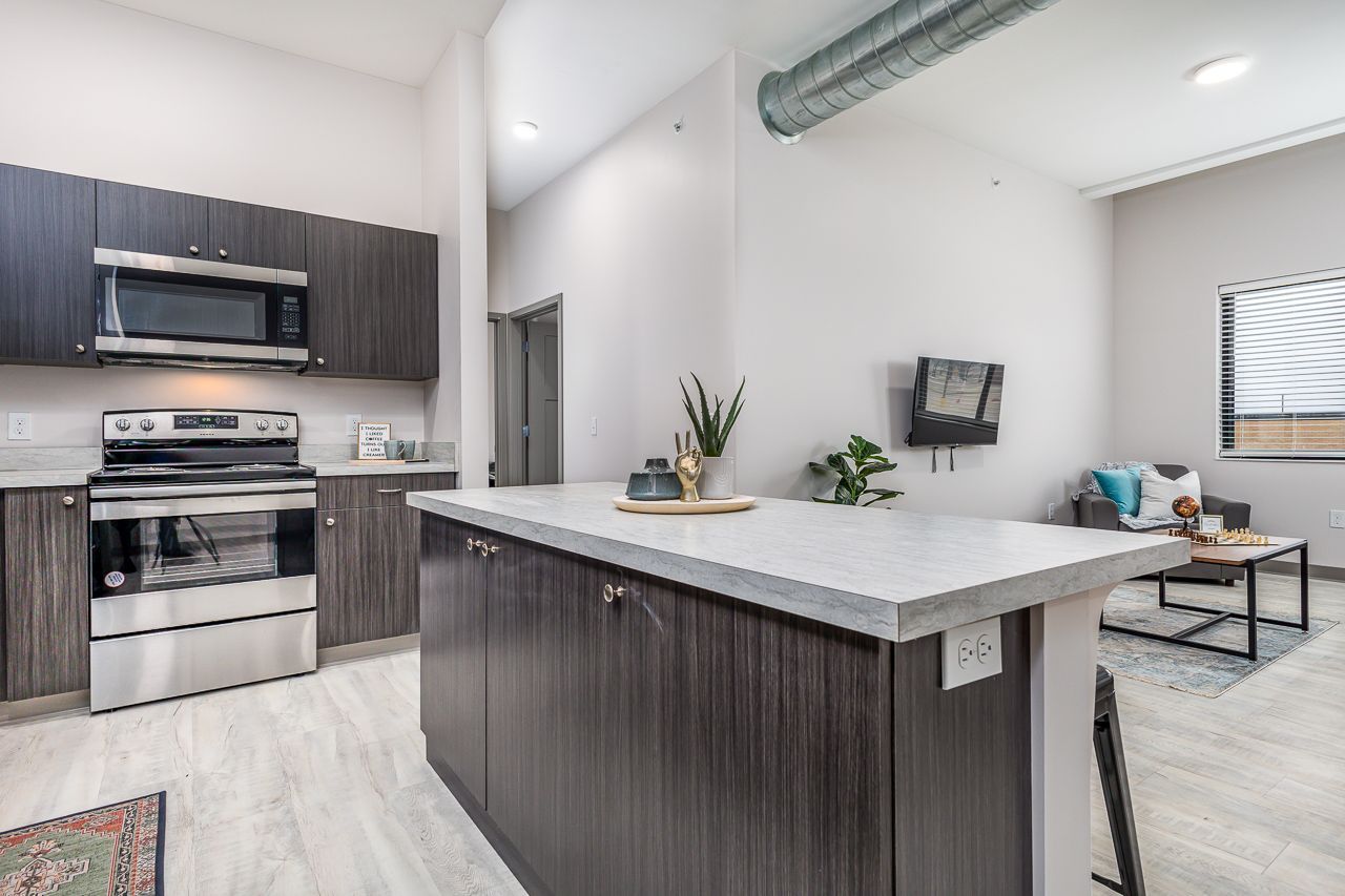 View of the kitchen in a 4 bedroom apartment at College Suites in Peosta, Iowa close to NICC's college campus