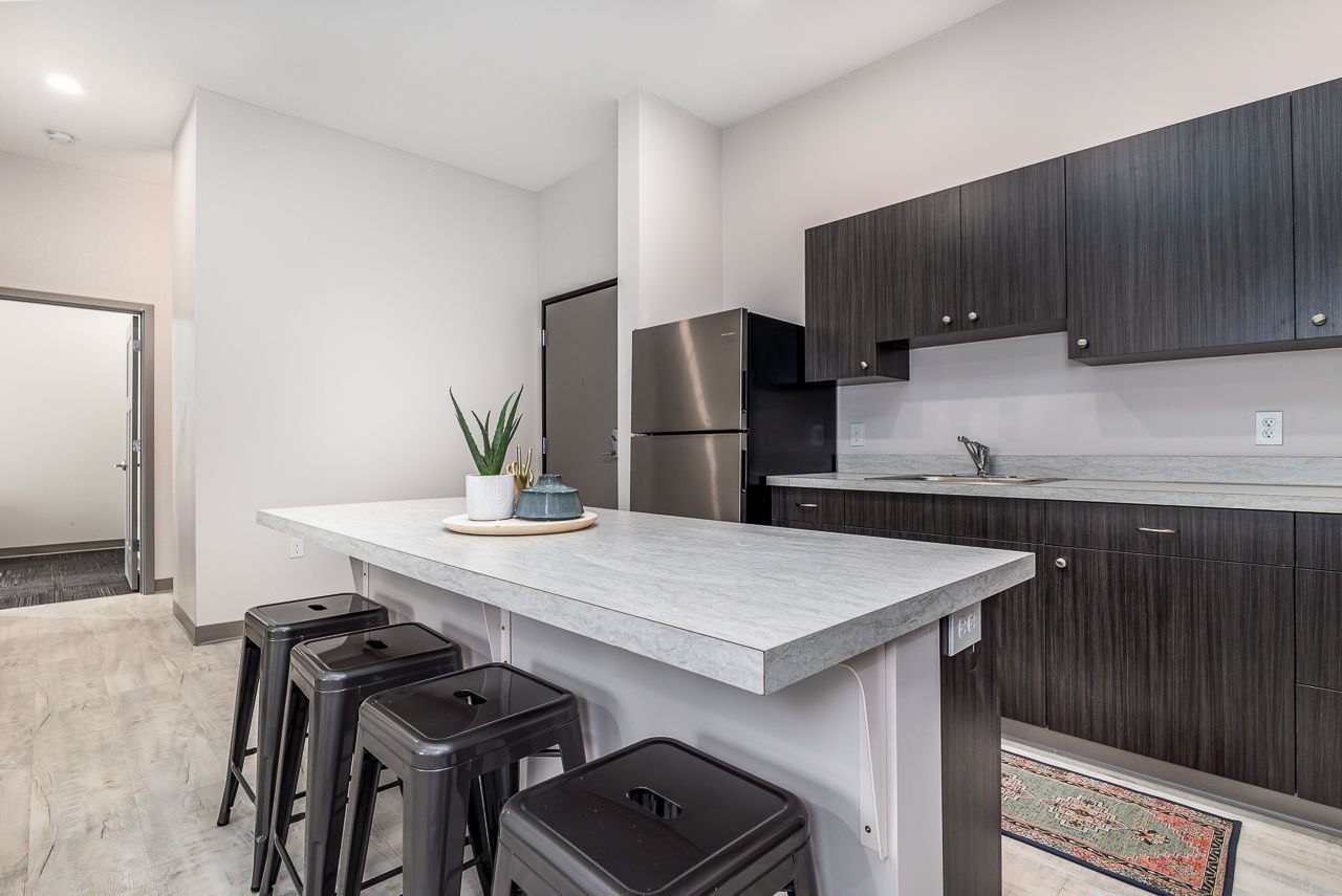 View of the kitchen in a 4 bedroom apartment at College Suites in Peosta, Iowa close to NICC's college campus
