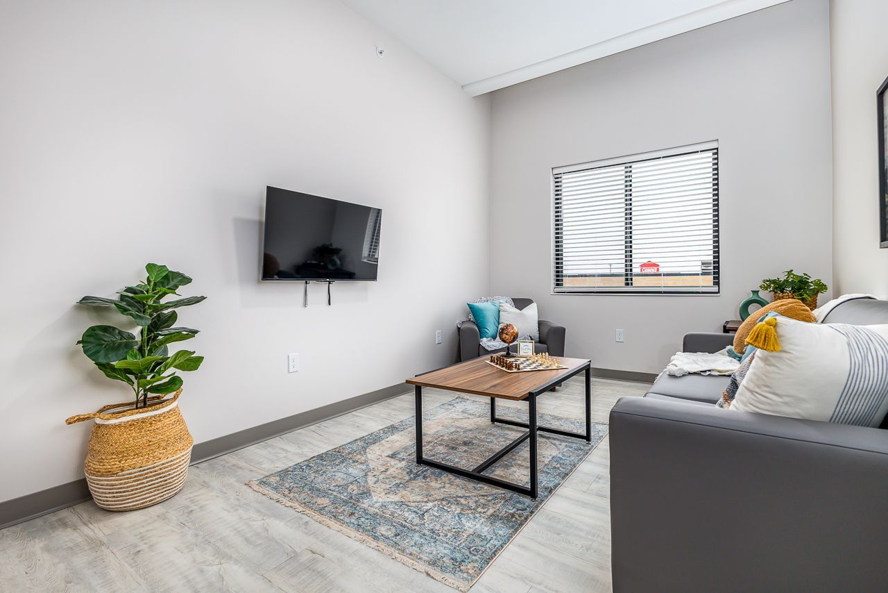 View of the living room in a 4 bedroom apartment at College Suites in Peosta, Iowa close to NICC's college campus