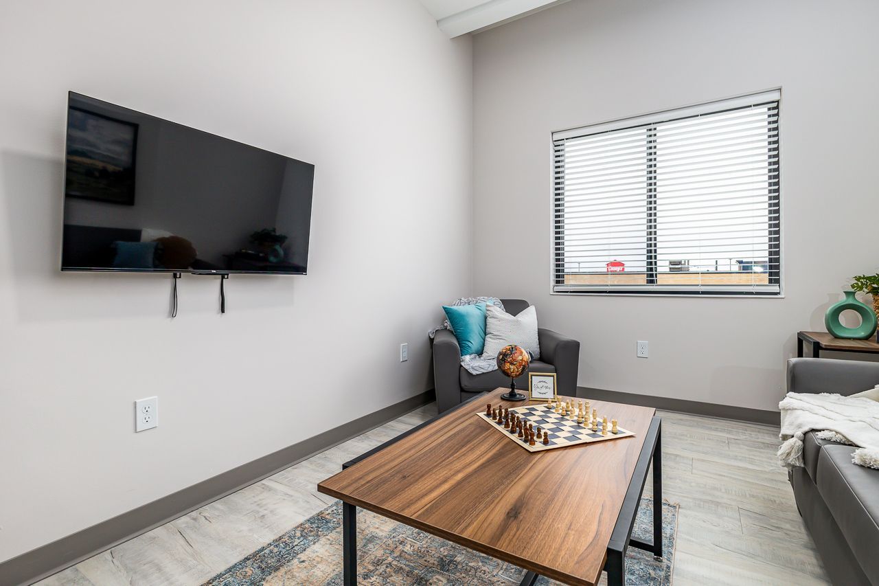 View of the living room in a 4 bedroom apartment at College Suites in Peosta, Iowa close to NICC's college campus