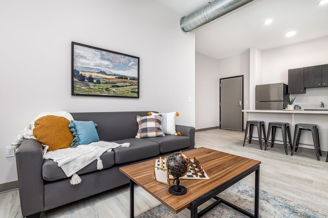 View of the living room in a 4 bedroom apartment at College Suites in Peosta, Iowa close to NICC's college campus