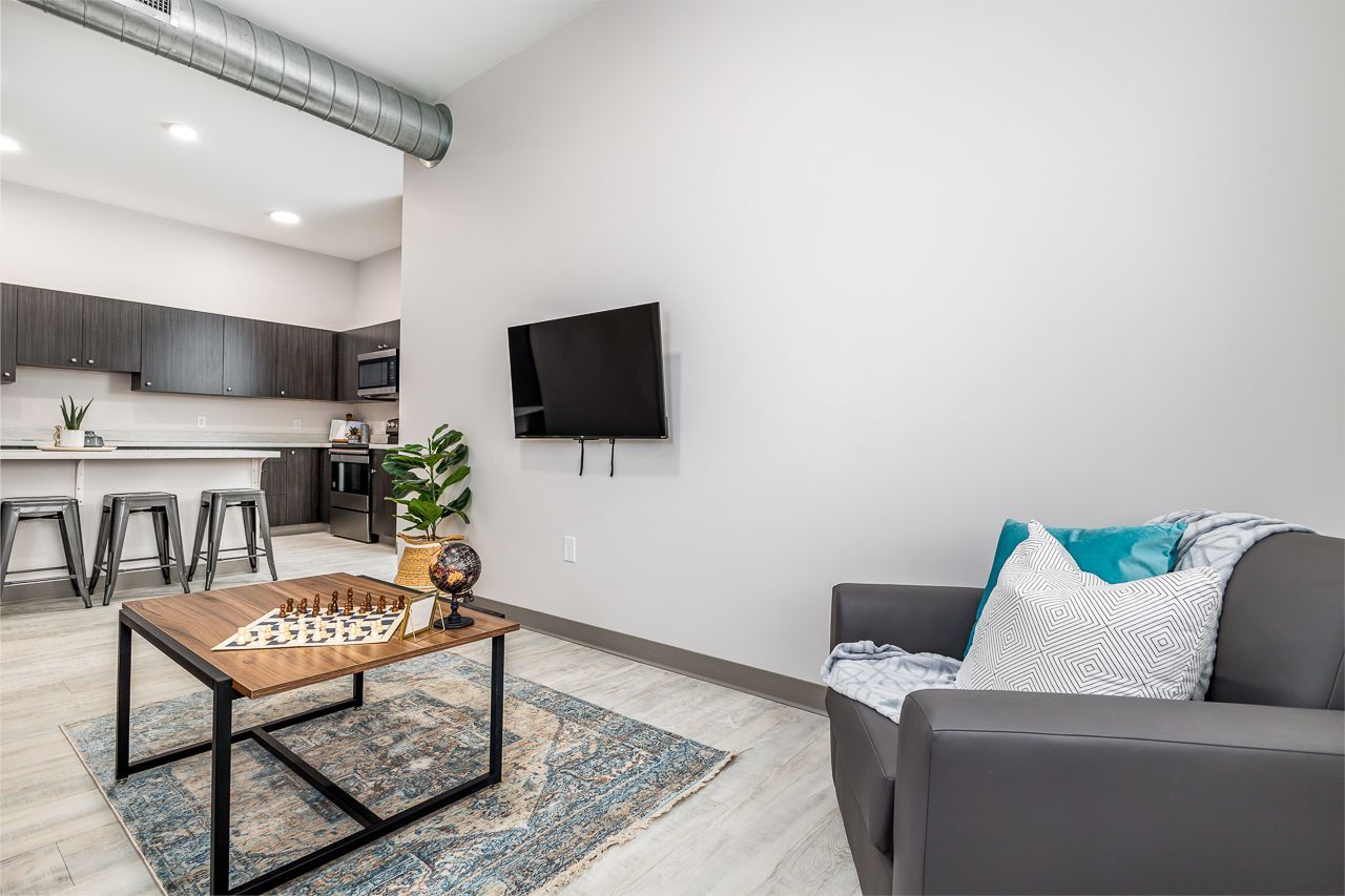 View of the living room in a 4 bedroom apartment at College Suites in Peosta, Iowa close to NICC's college campus