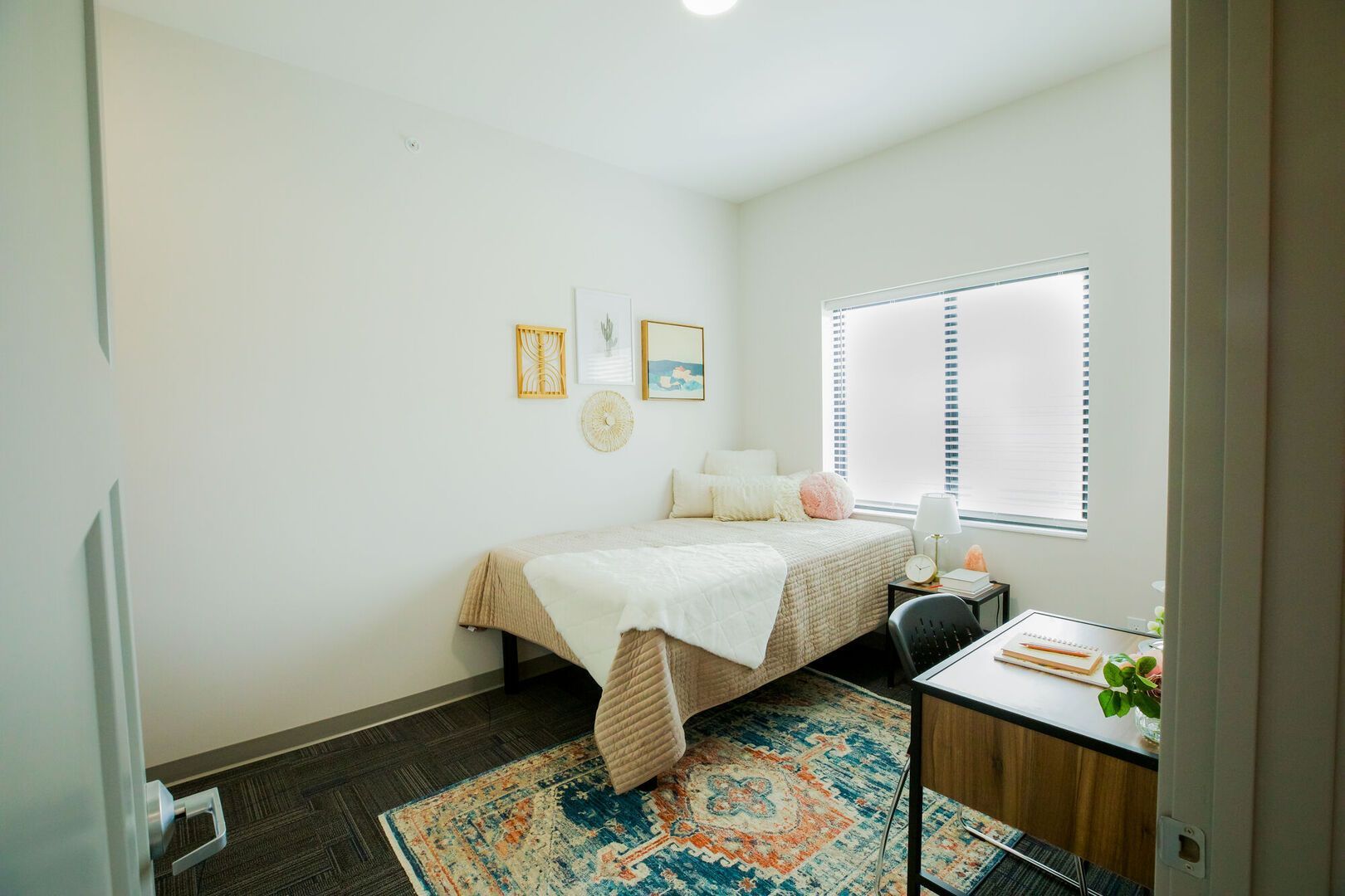 View of a bedroom in an apartment at College Suites in Peosta, Iowa close to NICC's college campus