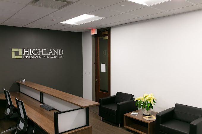 A reception area with a highland sign on the wall