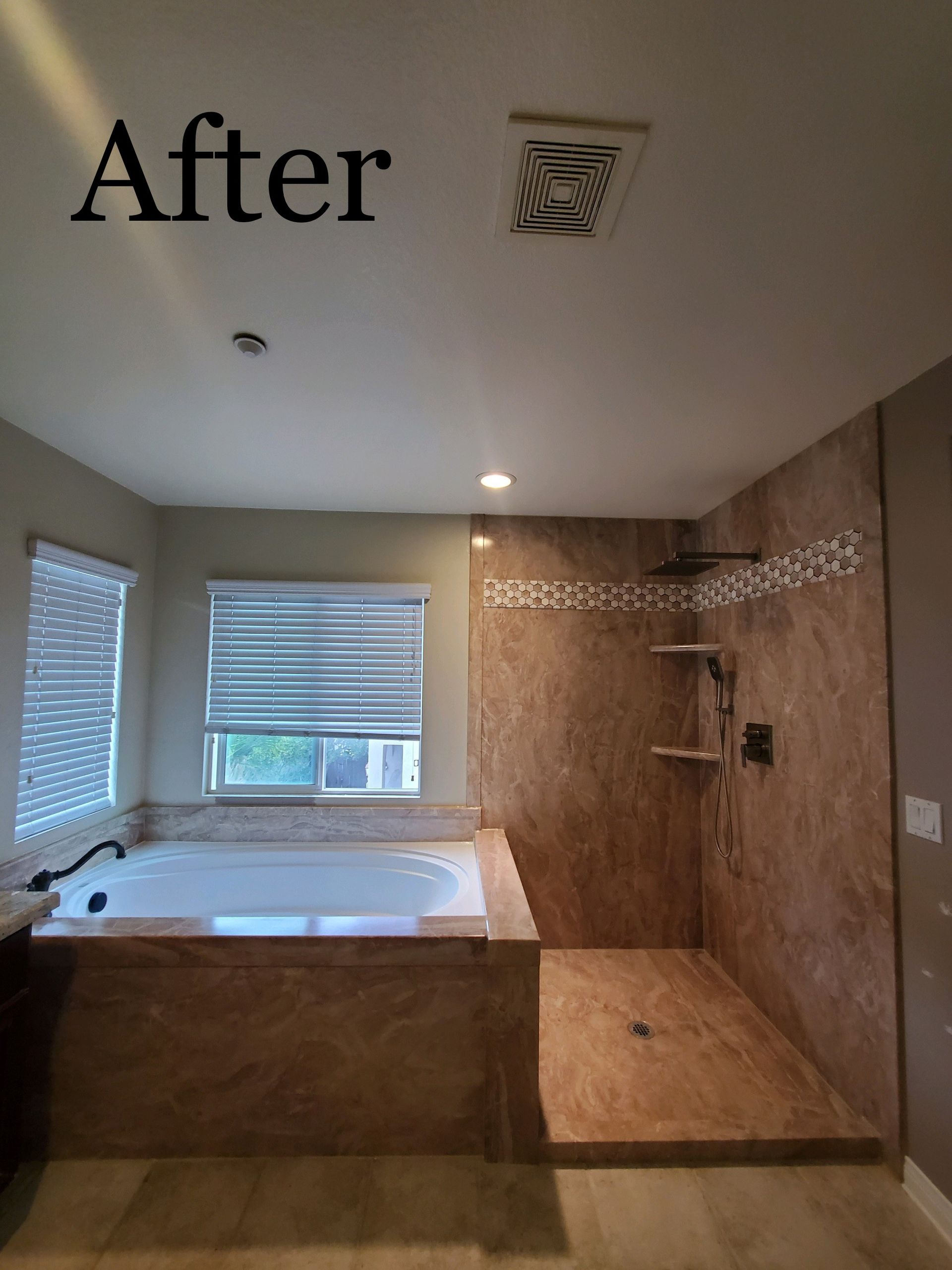 A bathroom with a jacuzzi tub and a walk in shower.