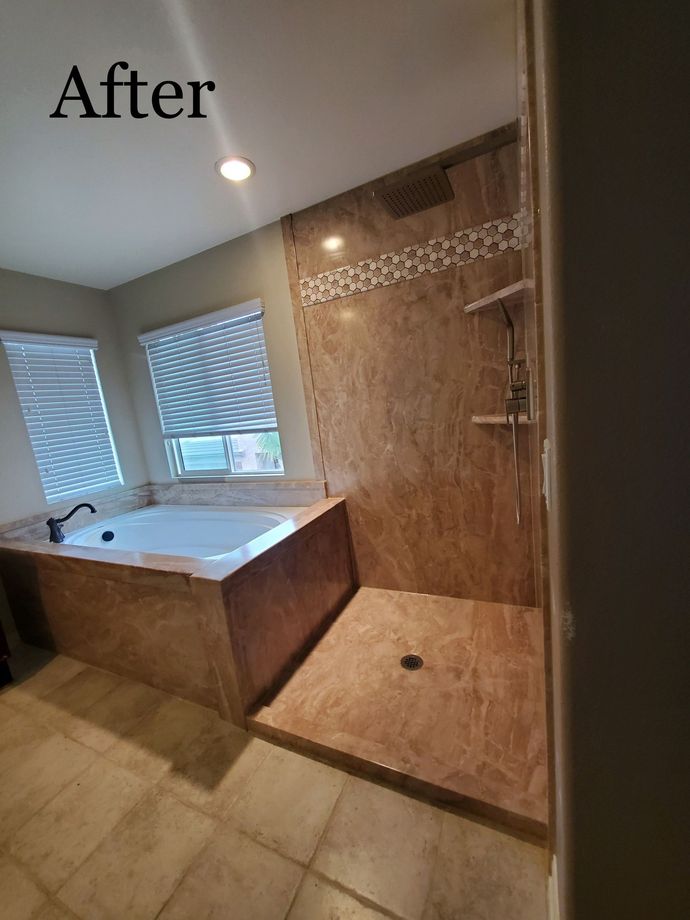 A bathroom with a tub and a walk in shower.